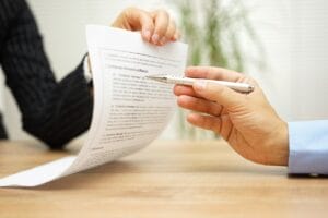 businesswoman holding legal document and wants an explaination