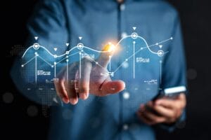 Analyst working with computer in Business Analytics and Data Management System to make report with KPI and metrics connected to database. Corporate strategy for finance, operations, sales, marketing.