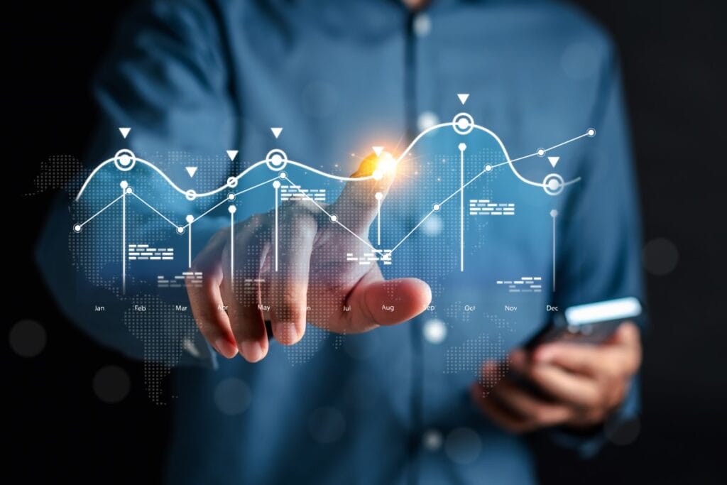 Analyst working with computer in Business Analytics and Data Management System to make report with KPI and metrics connected to database. Corporate strategy for finance, operations, sales, marketing.