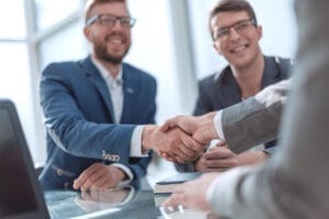 close up successful business people shaking hands